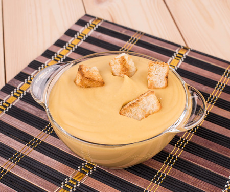 Close up of pea soup in a bowl. Whole background.の写真素材