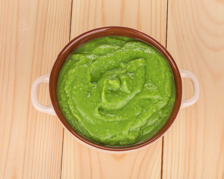 Broccoli cream soup on table isolated closeupの写真素材