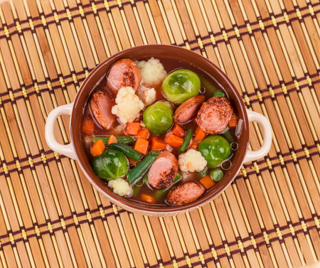 Soup of mashed potatoes with vegetables on a white backgroundの写真素材