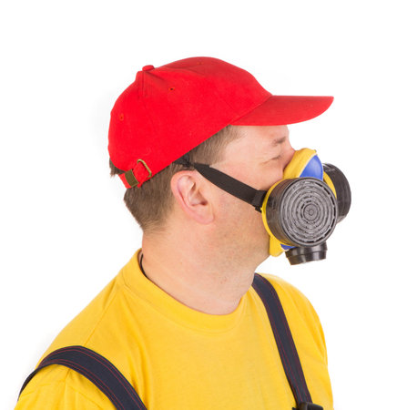 Worker in hat with respirator. Isolated on a white background.の写真素材