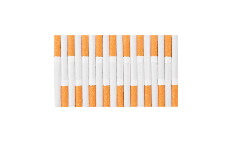 Cigarettes with a brown filter. Isolated on a white background.の写真素材