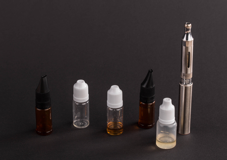 Big advanced electronic cigarette. Located on a black background.の写真素材