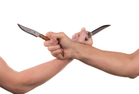 Blocking arms with a knife. Isolated on a white background.の写真素材