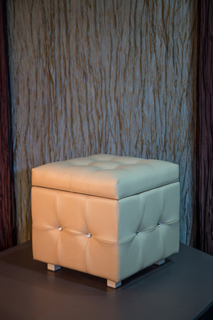 Beige leather cube chair with diamante buttonsの写真素材
