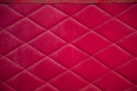 Red fabric texture with rhombuses, sofa upholsteryの写真素材