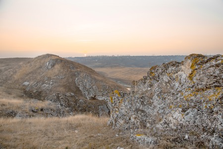 Grey rocks against milky sky in a beautiful country landscapeの写真素材