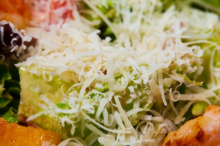 Warm salad with grilled shrimps and croutons. As a whole background.の写真素材