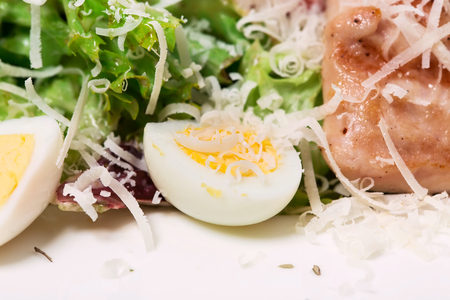 Warm salad with grilled salmon and quail eggs. As a whole background.の写真素材