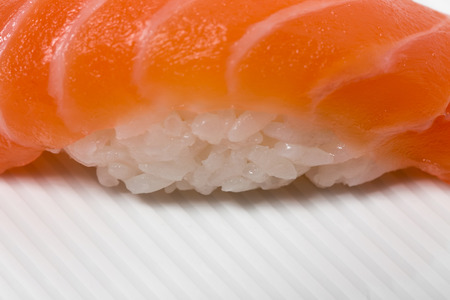 Traditional japanese salmon nigiri sushi. As a whole background.の写真素材