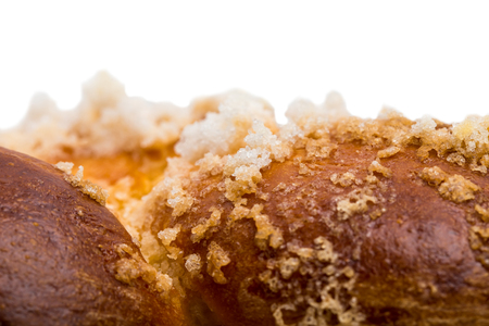 Sweet braided bread with crunchy sugar. Macro. Can be used as a whole background.の写真素材