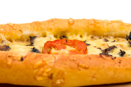 Delicious pie with tomatoes and cheese. Macro. Can be used as a whole background.の写真素材