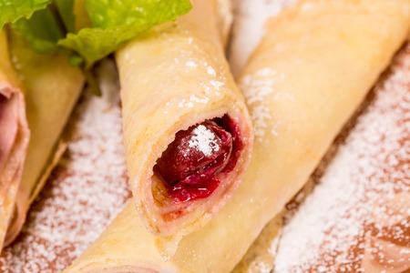 Closeup of traditional russian pancake with cherry. Macro. Can be used as a whole background.の写真素材