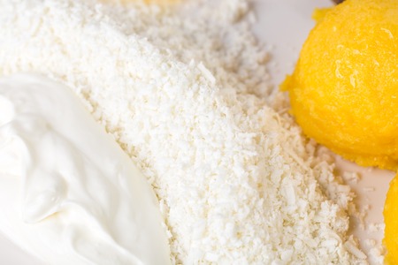 Traditional moldovan mamaliga porridge with grated cheese and sour cream. Macro. Photo can be used as a whole background.の写真素材