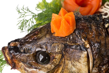 Head of baked sturgeon with vegetables. Macro. Photo can be used as a whole background.の写真素材