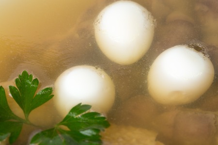 Delicious chicken meat galantine with fresh herbs and quail eggs.. Macro. Photo can be used as a whole background.の写真素材