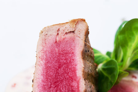 Grilled tuna fillet with corn salad and delicious sauce. Macro. Photo can be used as a whole background.の写真素材