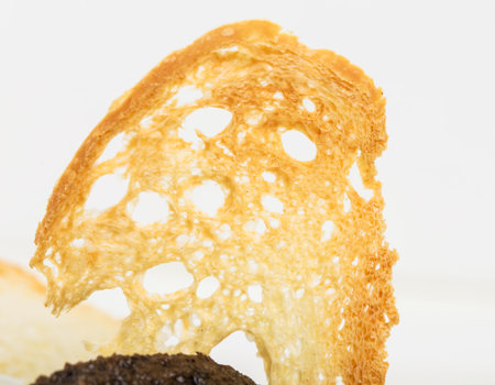 Wheat rusk for salmon tartar close up. Macro. Photo can be used as a whole background.