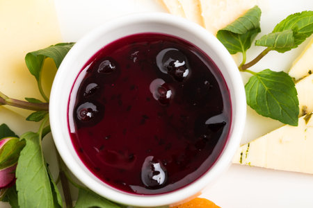 Closeup of berry dip sauce for cheese platter. Macro. Photo can be used as a whole background.の写真素材