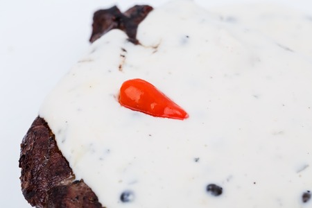 Delicious beef steak covered with mushroom sauce. Macro. Photo can be used as a whole background.の写真素材