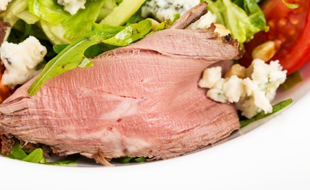 Warm roast beef salad with goat cheese and pine nuts. Macro. Photo can be used as a whole background.の写真素材