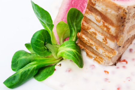 Grilled tuna fillet with corn salad and delicious sauce. Macro. Photo can be used as a whole background.の写真素材