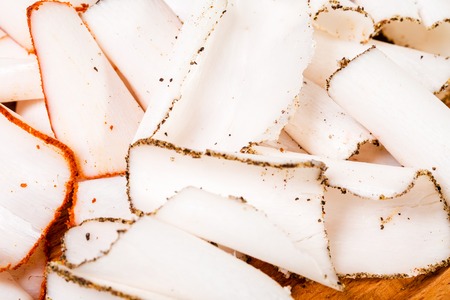 Delicious spiced pork lard mix on wooden platter. Ukrainian cuisine. Macro. Photo can be used as a whole background.の写真素材