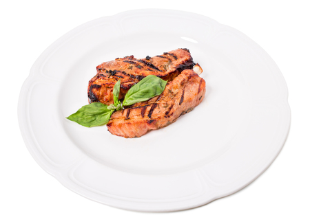 Delicious grilled pork shish kebab with basil and herbs. Isolated on a white background.の写真素材