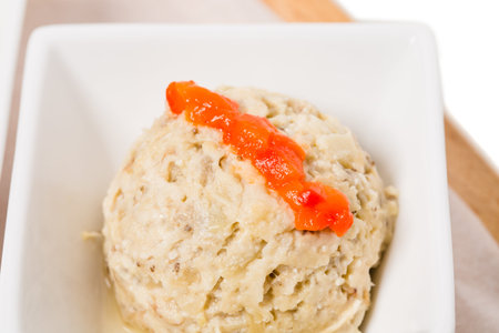 Delicious eggplant pate with red paprika. Macro. Photo can be used as a whole background.