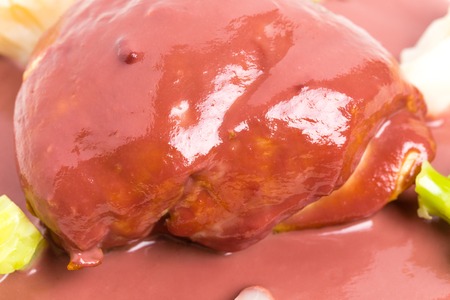 Chicken breast with foie gras covered with delicious beet mousse and vegetables as a garnish. Macro. Photo can be used as a whole background.の写真素材