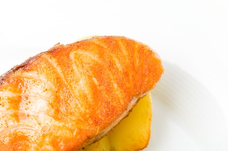 Grilled salmon fillet with roast potatoes. Macro. Photo can be used as a whole background.の写真素材