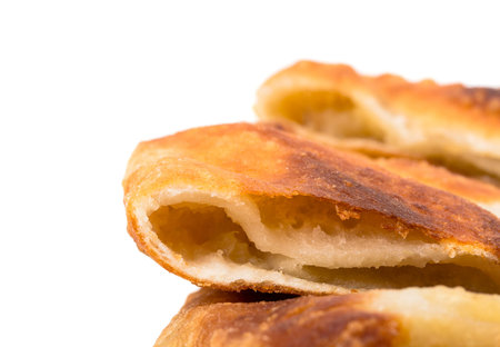 Delicious sliced puff pie with potatoes. Macro. Photo can be used as a whole background.