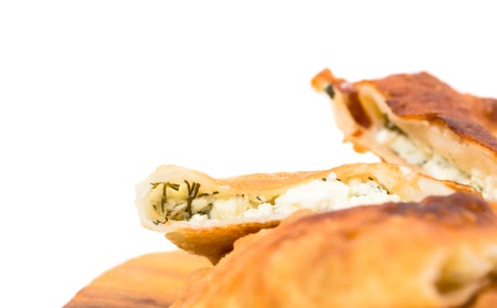 Delicious sliced puff pie with curd cheese and fresh dill. Macro. Photo can be used as a whole background.の写真素材