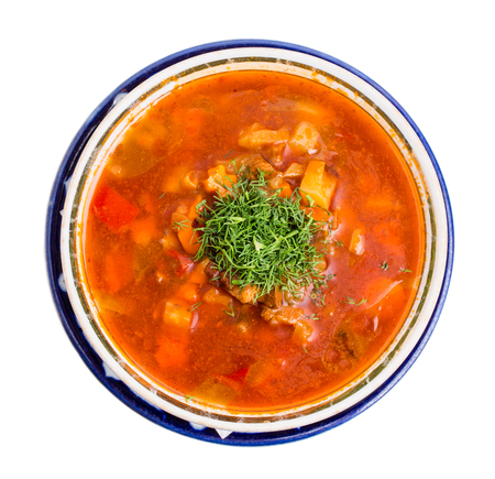 Hot tomato soup with beef and dill. Isolated on a white background.の写真素材