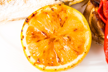 Grilled vegetables closeup as a garnish for grilled seabass. Macro. Photo can be used as a whole background.の写真素材
