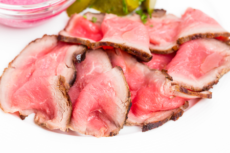 Sliced roast beef with pickles and horseradish cream. Macro. Photo can be used as a whole background.の写真素材