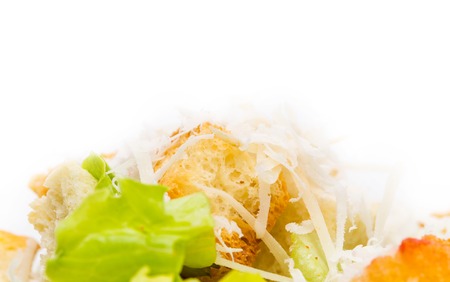 Delicious vegetable salad with croutons and grated cheese. Macro. Photo can be used as a whole background.の写真素材