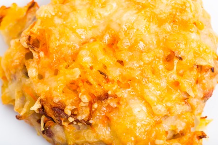 Chicken rissole covered with cheese. Macro. Photo can be used as a whole background.の写真素材