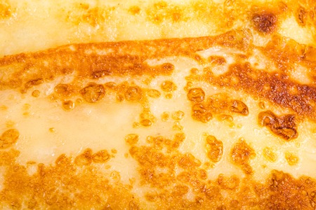 Russian pancake stuffed with salted cottage cheese. Macro. Photo can be used as a whole background.の写真素材