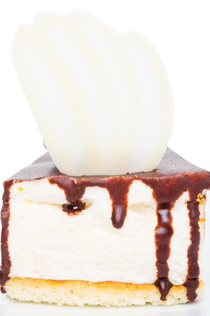 Delicious cake with chocolate curl and hazelnut. Macro. Photo can be used as a whole background.の写真素材