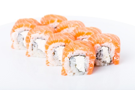 Delicious salmon sushi roll with mayonnaise. Macro. Photo can be used as a whole background.の写真素材