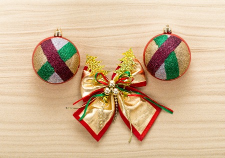 Christmas ribbon decoration and Christmas balls on sand. Photo can be used as a whole background.の写真素材