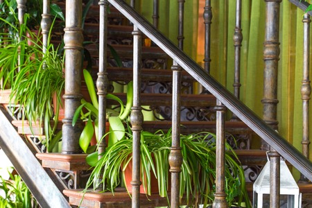 Closeup of staircase with flower pots. Element of country restaurant. Photo can be used as a whole background.の写真素材