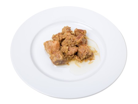 Stewed pork fillet with onions. Isolated on a white background.の写真素材