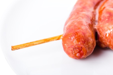 Delicious grilled beef sausage on skewers. Macro. Photo can be used as a whole background.の写真素材