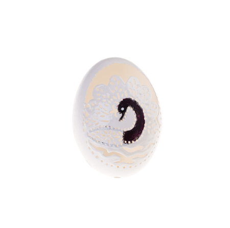 Easter hen's egg with carving. Macro. Isolated on a white background.の写真素材