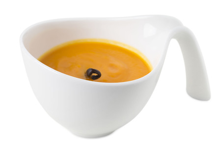 Pumpkin cream soup with vanilla aroma. Isolated on a white background.の写真素材