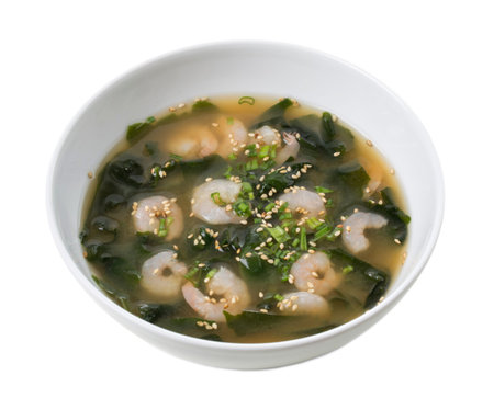 Japanese miso soup with shrimps and kombu seaweed. Isolated on a white background.の写真素材