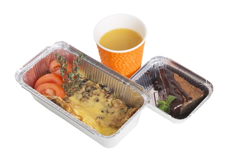 Omelet and dessert in takeaway containers. Isolated on a white background.の写真素材