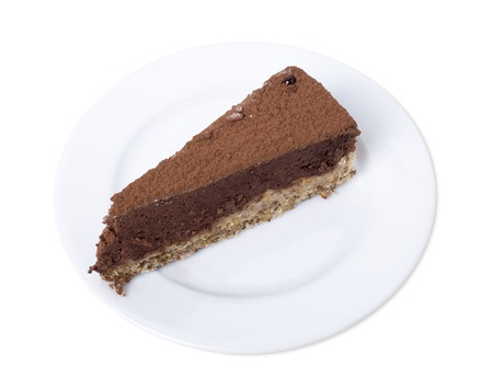 Chocolate cheesecake with cacoa powder. Isolated on a white background.の写真素材