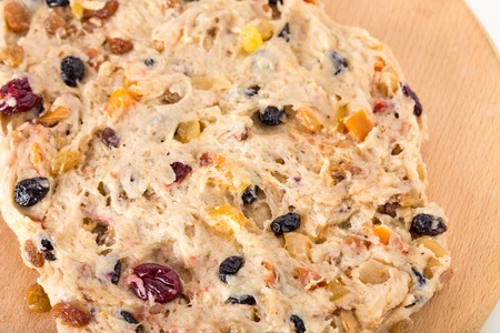 Dough for pie  on a wooden salver.  Photo can be used as a whole background.の写真素材